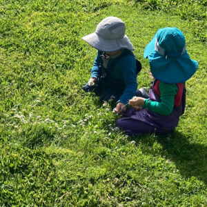 young children playing in nature